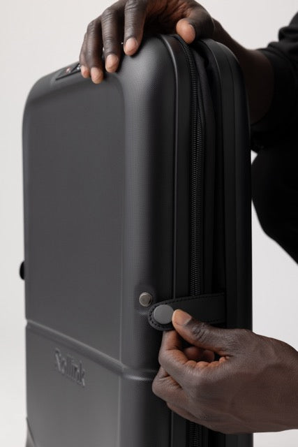 Rollink Flex Light foldable suitcase showing button closure.